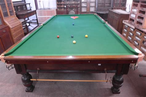 A full size snooker table, with accessories