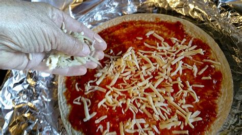 Adding Cheese To Homemade Pizza Free Stock Photo - Public Domain Pictures