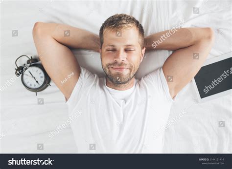 Tired Man Sleeping On Bed After Stock Photo 1144121414 | Shutterstock