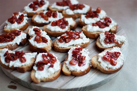 Roasted Tomato Crostini with Basil Pesto - Pretty in Pistachio