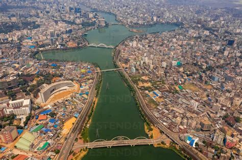 Aerial view of Hatir Jheel lake in Dhaka city center with city skyline ...