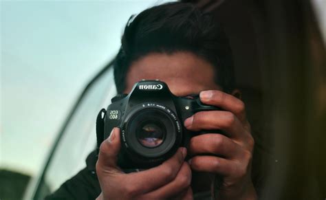 Person Shooting Canon Camera · Free Stock Photo