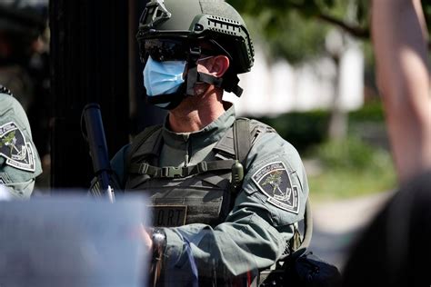 Riot forces at White House include tactical teams wearing insignia from Texas federal prisons