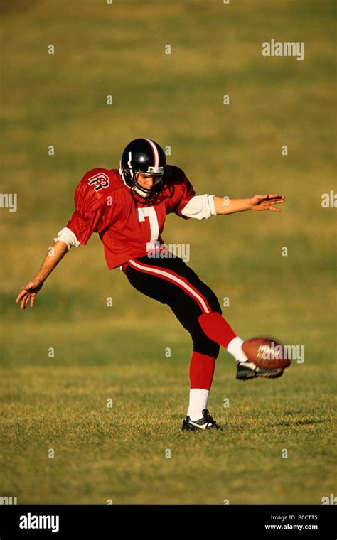 Football kicker in action Stock Photo - Alamy