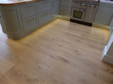 LED strip plinth lighting adds warmth to this oak kitchen floor | Plinth lighting, Kitchen ...