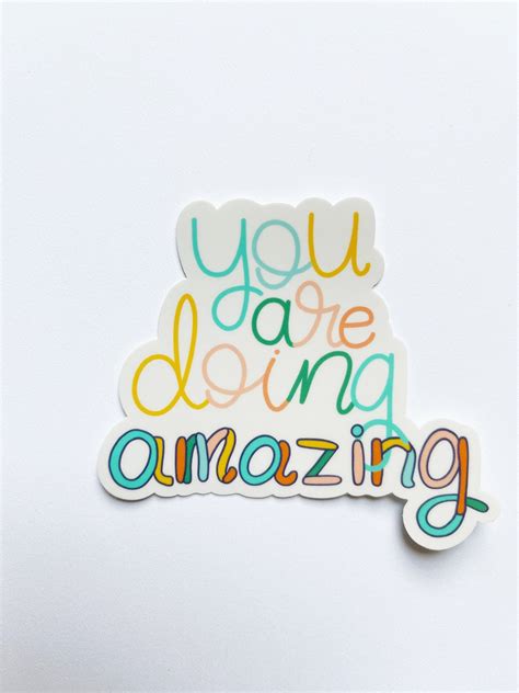 you are doing amazing sticker sitting on top of a white surface with the words you are doing ...