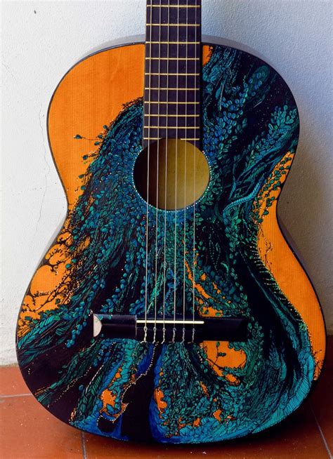 Gorgeous Ink Illustrations Painted on Guitars