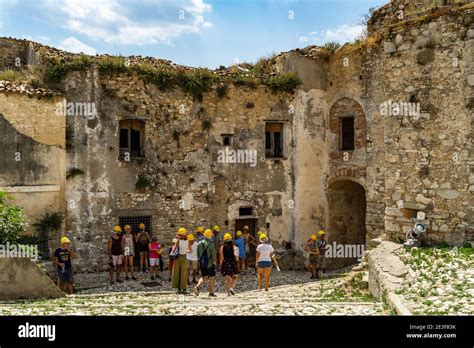 Craco, Basilicata, Italy, August 2020 - Tourists in a guided tour ...