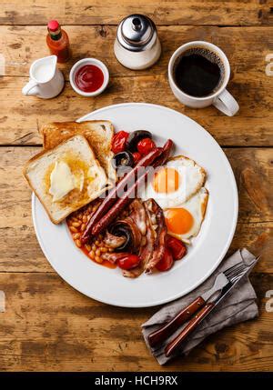 White Cup With Coffee Beans On Black Table Stock Photo Alamy