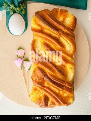 Wooden Board With Delicious Easter Cake And Pussy Willow Branches On Brown Background Stock