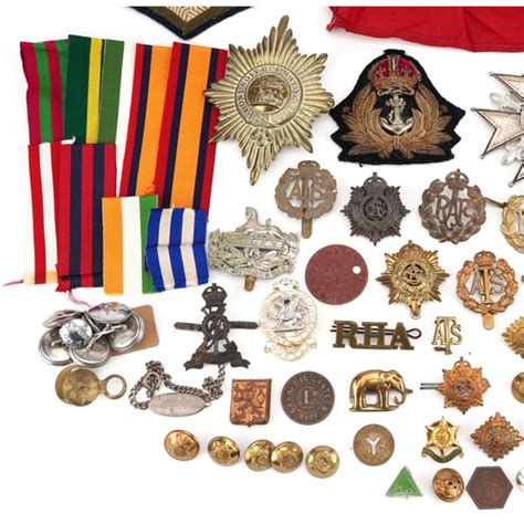 A Large Collection Of British Militaria Including Cap Badges Buttons