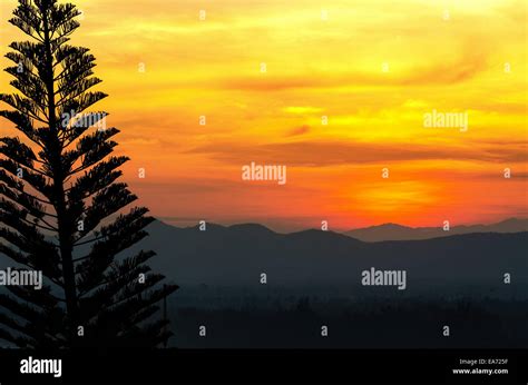 Beautiful Orange And Red Sky Over Mountain Range After Sunset Stock