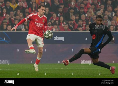 Kerem Aktuerkoglu Of SL Benfica L And Alejandro Balde Of FC Barcelona