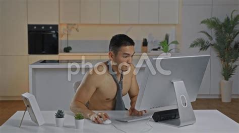 Free Photos A Man Looking At A Computer Naked To The Waist