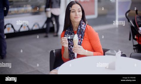 Woman Eating An Ice Cream In A Parlor Or Cafe Stock Photo Alamy