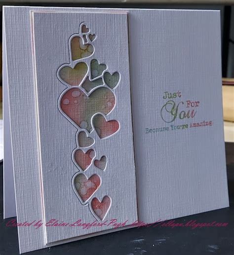 An Open Card With Hearts On It