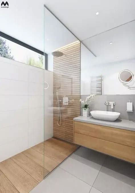 A Minimalist Bathroom With Lots Of Wood In 2025 Wood Tile Bathroom