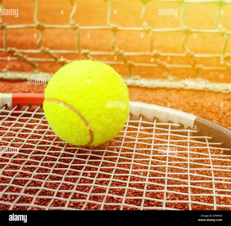 Tennis Racket With Ball On It Clay On Clay Court Stock Photo Alamy