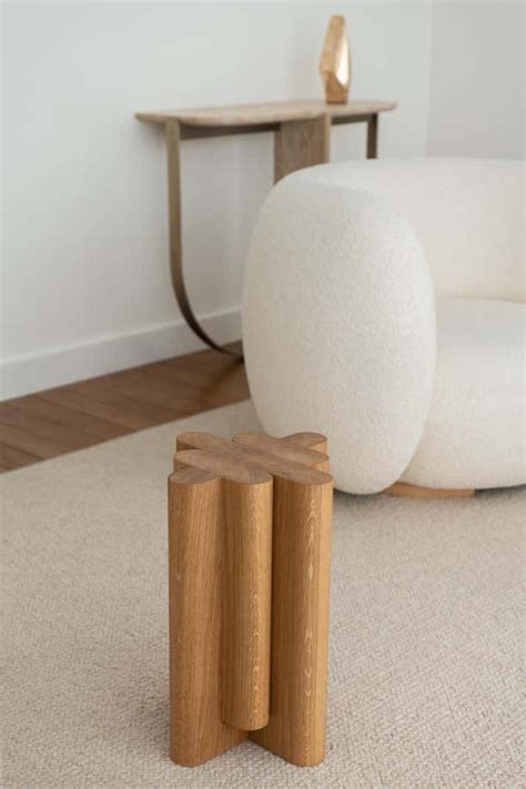 Two Wooden Blocks Sitting On The Floor Next To A White Chair