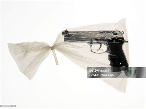 Handgun In Plastic Bag Sealed With Unresealable Plastic Tie Closeup
