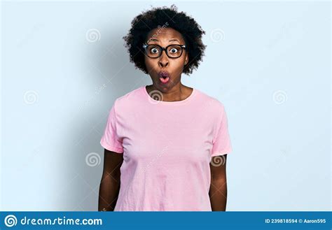 African American Woman With Afro Hair Wearing Casual Clothes And Glasses Afraid And Shocked With