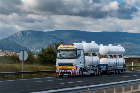 Special Transport Truck Loaded With New Small Gas Tanks Driving On A