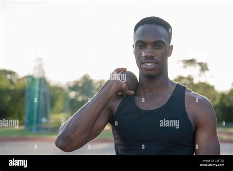 Portrait Of Athlete Holding Shot Put Stock Photo Alamy