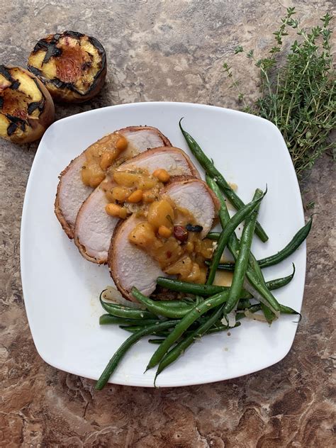 Bacon Wrapped Pork Loin With Spicy Peach Chutney Garlic Green Beans And Spicy Sweet Potatoes