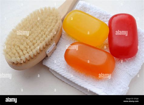 Red Orange And Yellow Bars Of Soap On A White Folded Flannel With A