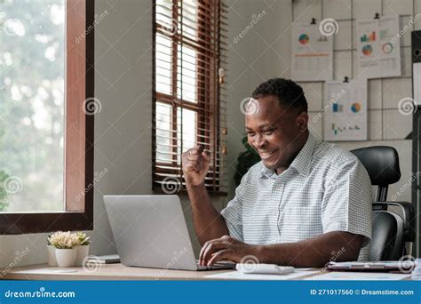 Smiling Black Man Using Laptop At Home In Living Room Happy Mature