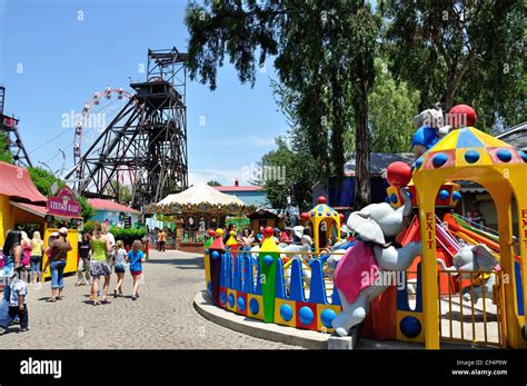 Coal winding gear and children's rides at Gold Reef City Theme Park ...