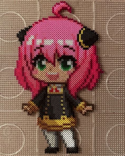 A Close Up Of A Cross Stitch Doll