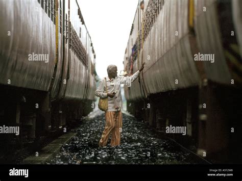 Man Standing Between Trains Stock Photo Alamy