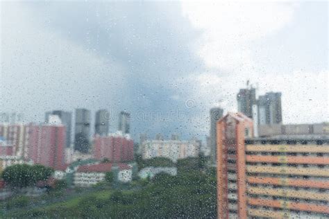 Rain Drops On Window Rainy Day And Apartment Urban Scene Stock Photo