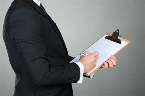 Premium Photo Businessman Holding A Clipboard