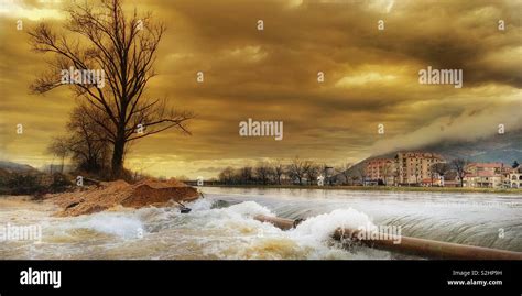 Angry river and moody skies Stock Photo - Alamy