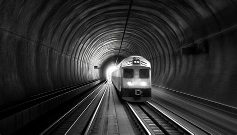 Premium Ai Image High Speed Train Races Through Dark Subway Tunnel Vanishing Into Distance