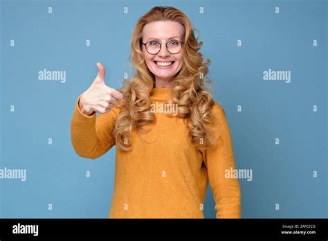 Active Happy Mature Woman In Glasses Showing Thumb Up Approving Your