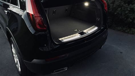 Illuminated Cargo Sill Plate With Premium Carpet Cargo Mat Cadillac