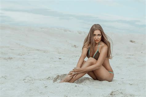 Download Sexy Beach Model Pose On White Sand Wallpaper