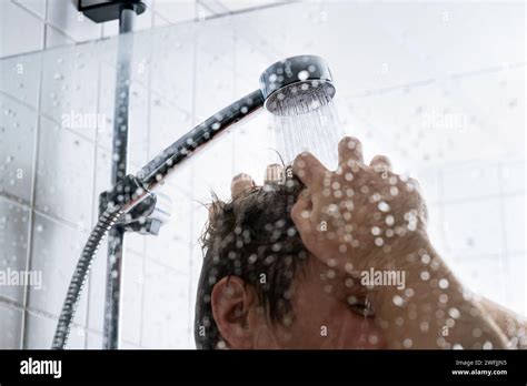 Washing Hair With Shampoo Man In Shower Cold Or Hot Water