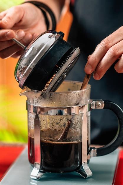 Premium Photo Barista Making French Press Coffee