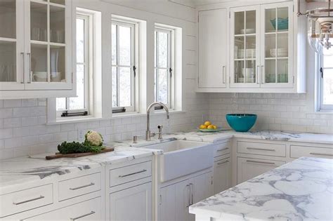 Calcutta Gold Marble Kitchen Countertops With White Subway Tiles