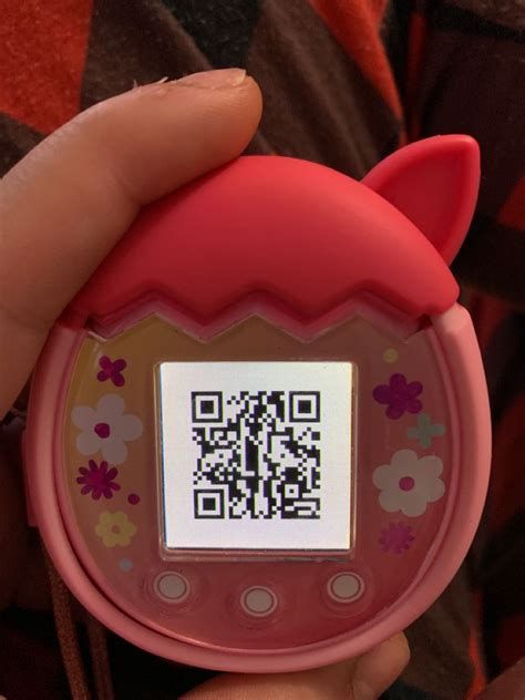 A Person Is Holding A Qr Code Device In Their Hand And It S Pink