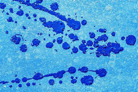 Concrete Wall Surface Texture Background With Splashes Of Blue Paint