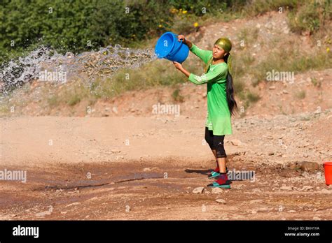 Throwing Bucket Water High Resolution Stock Photography And Images Alamy