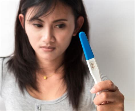 Premium Photo Upset Woman Holding Positive Pregnancy Test Result