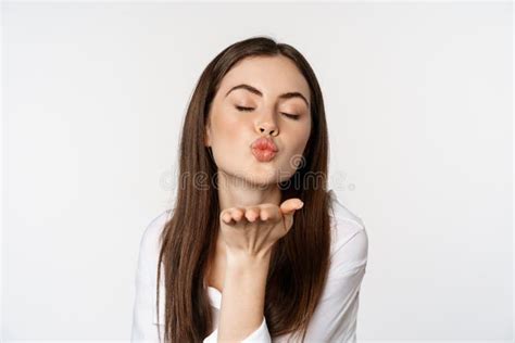 Feminine Woman Sending Air Kiss At Camera Coquettish Flirty Pose