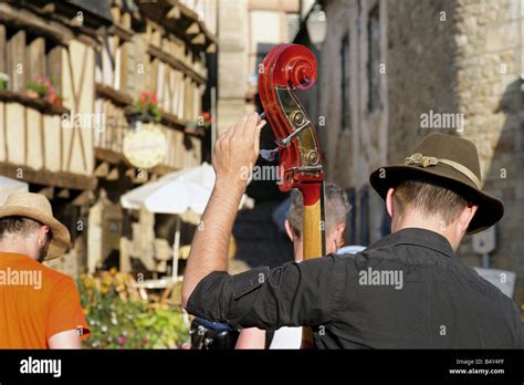 musician tuning up his string bass Stock Photo - Alamy