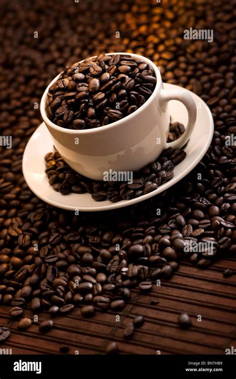 Cup Filled With Delicious Roasted Coffee Beans Stock Photo Alamy